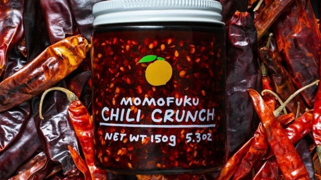 jar of momofuku chili crunch on bed of dried chili peppers