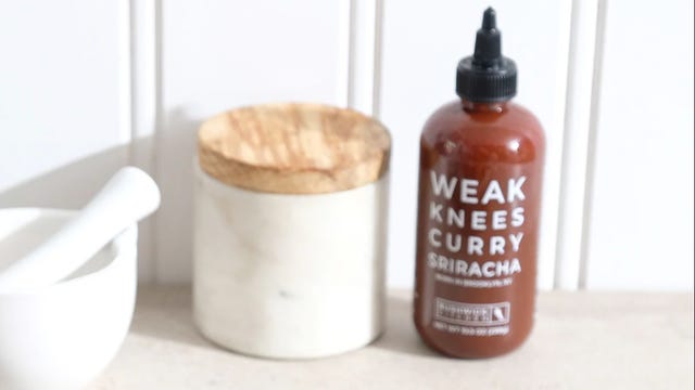 bottle of curry sriracha on counter