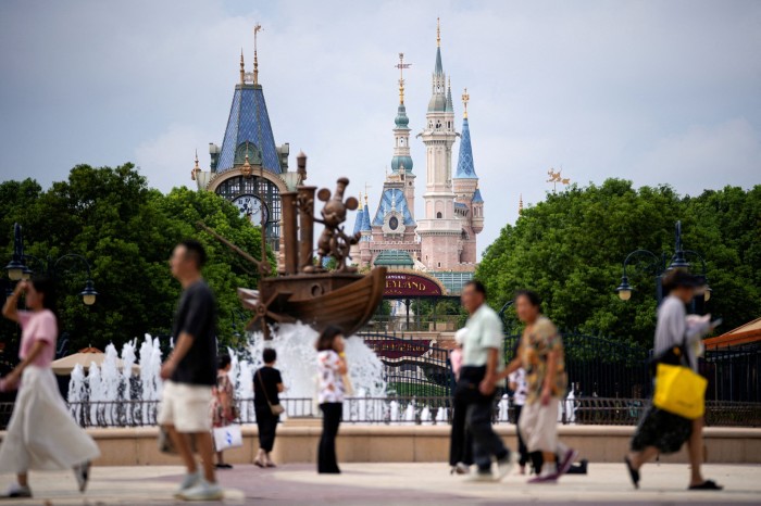 Live news: Disney shares sink over planned $60bn theme park spending plan